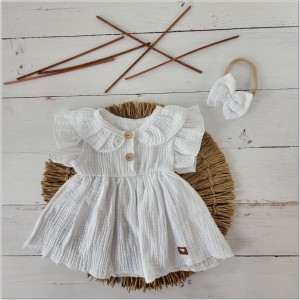 Muślinowa sukienka niemowlęca . Przewiewna dziewczęca sukienka na lato. Sukienka z opaską na lato dla niemowlaka. Biała sukienka na lato dla małej dziewczynki.