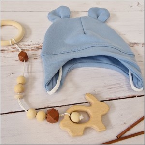 Czapka dresowa wiązana dla niemowlaka. Bawełniana czapeczka wiązana z uszkami. Okrycie główki dla niemowlaka na wiosnę, jesień. Niebieska czapka wiązana z uszkami dla bobasa.
