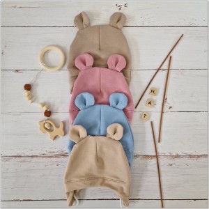 Czapka dresowa wiązana dla niemowlaka. Bawełniana czapeczka wiązana z uszkami. Okrycie główki dla niemowlaka na wiosnę, jesień. Niebieska czapka wiązana z uszkami dla bobasa.