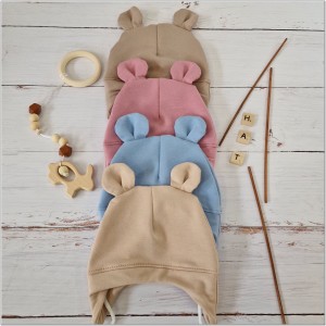 Czapka dresowa wiązana dla niemowlaka. Bawełniana czapeczka wiązana z uszkami. Okrycie główki dla niemowlaka na wiosnę, jesień. Niebieska czapka wiązana z uszkami dla bobasa.