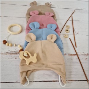 Czapka dresowa wiązana dla niemowlaka. Bawełniana czapeczka wiązana z uszkami. Okrycie główki dla niemowlaka na wiosnę, jesień. Niebieska czapka wiązana z uszkami dla bobasa.