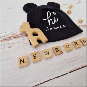 Bawełniana, elastyczna czapeczka dla noworodka. Czapeczka na wyjście ze szpitala dla niemowląt.  Czarna czapeczka z uszkami dla noworodka.